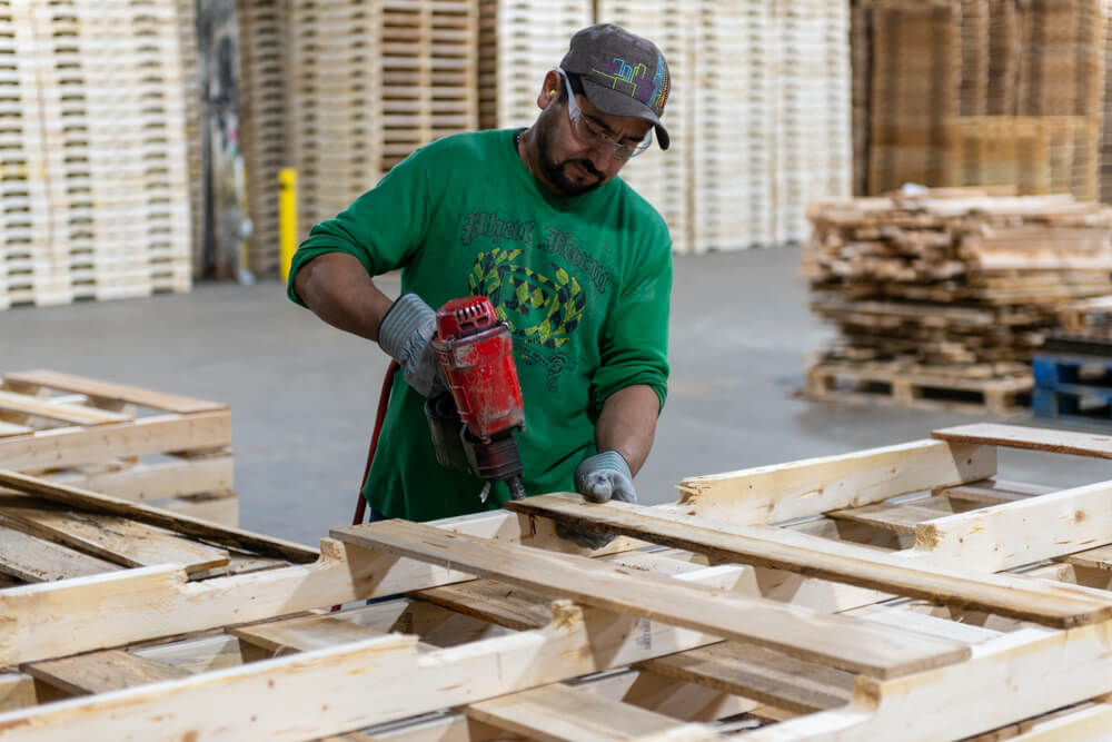 Worker building pallet